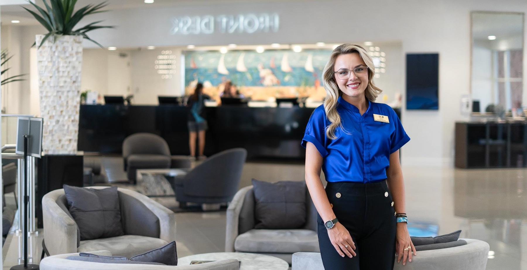 Lenzie Richardson, who graduated in hospitality and tourism management from the University of South Alabama, at the Perdido Beach Resort near the front desk, where she is an assistant manager.